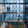 looking through glass wall across multiple floors
