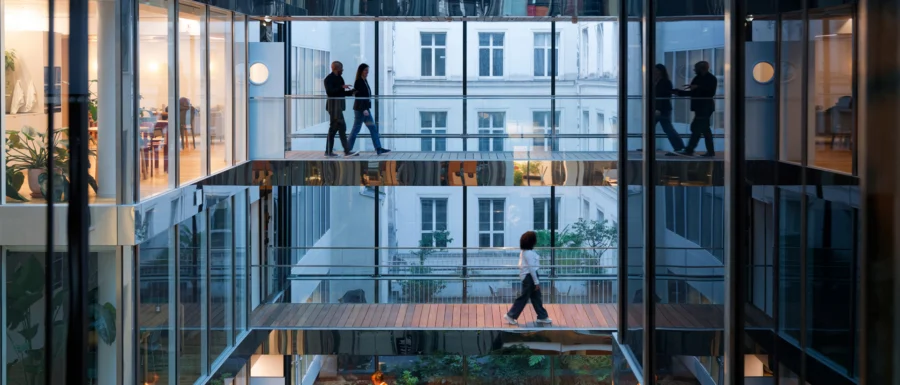 looking through glass wall across multiple floors