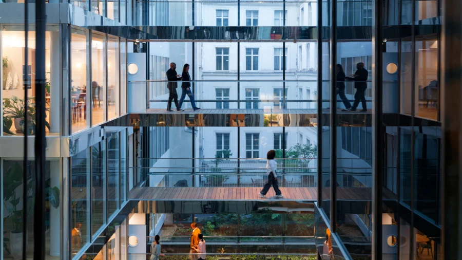 looking through glass wall across multiple floors